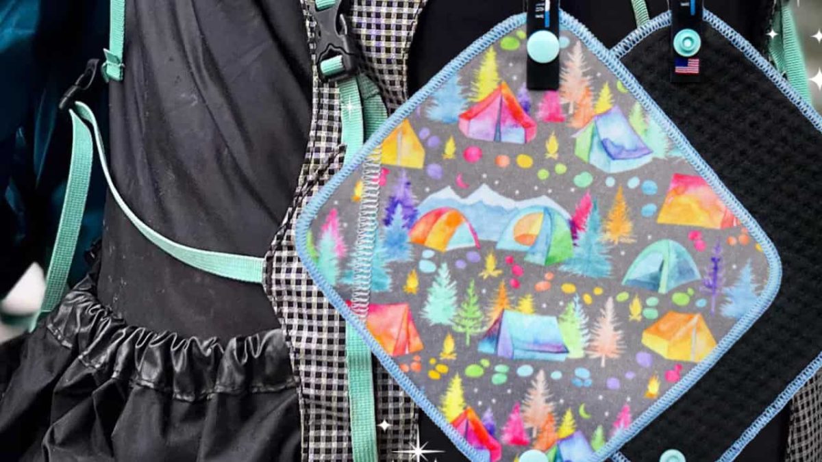 Kula Cloth hanging from a backpack on trail